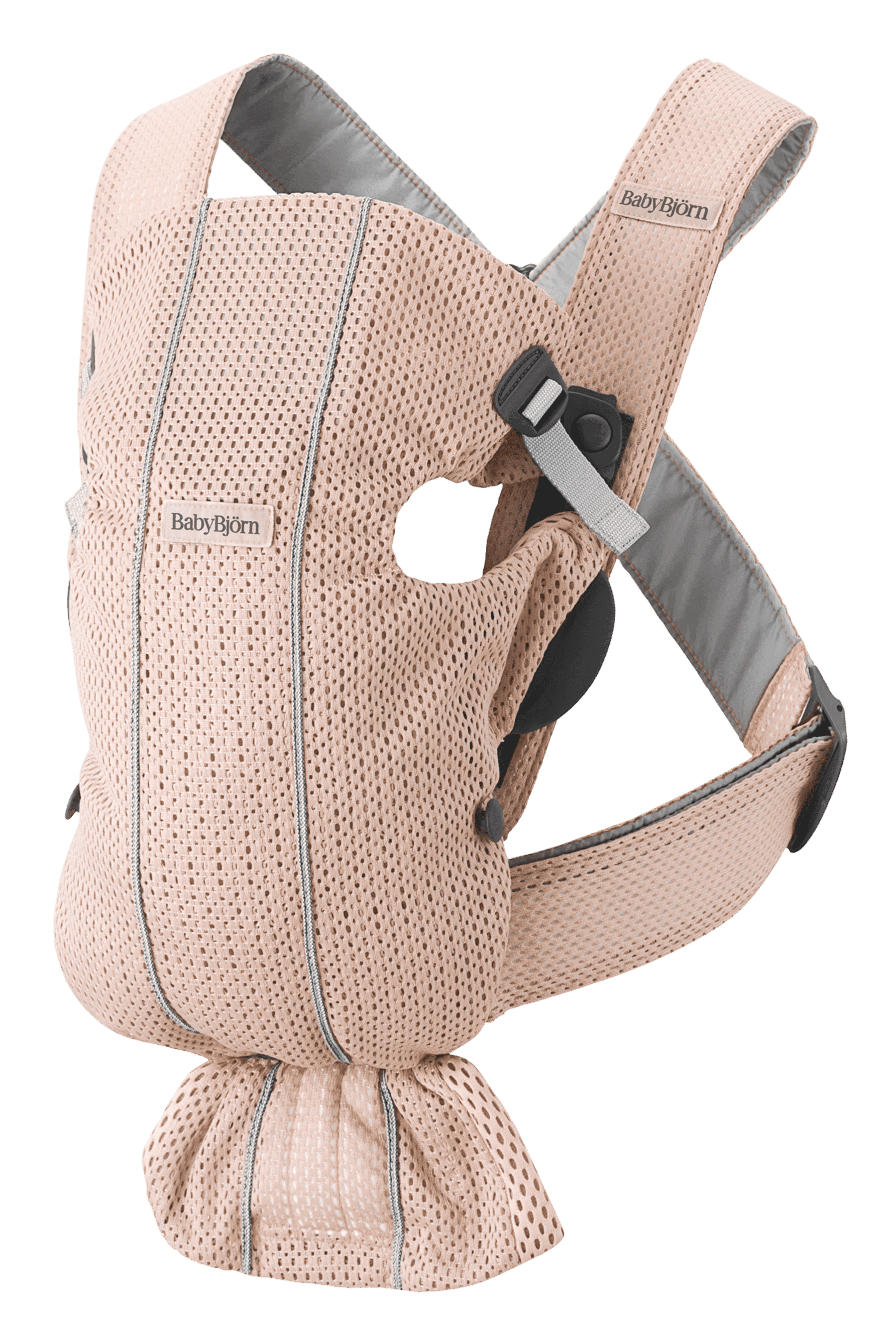 A beige BabyBjörn baby carrier with breathable mesh fabric and adjustable straps, designed for comfortable babywearing.