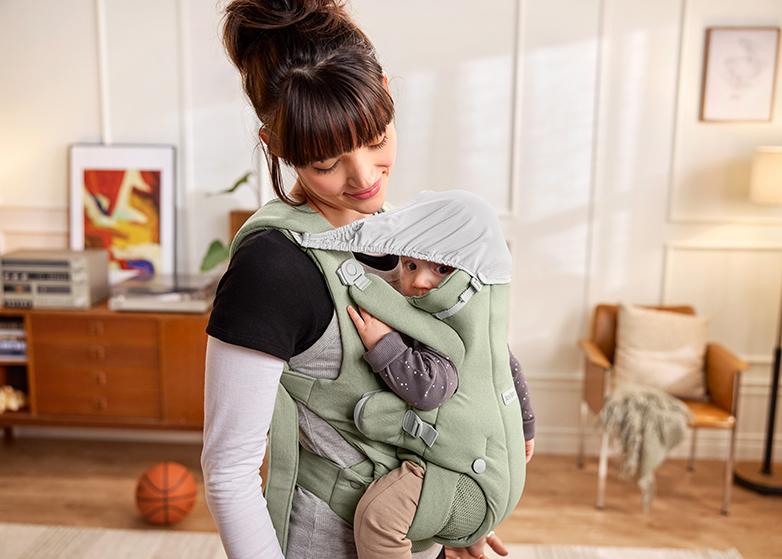 Baby Carrier Hold in light green brushed woven with integrated shade - BabyBjörn